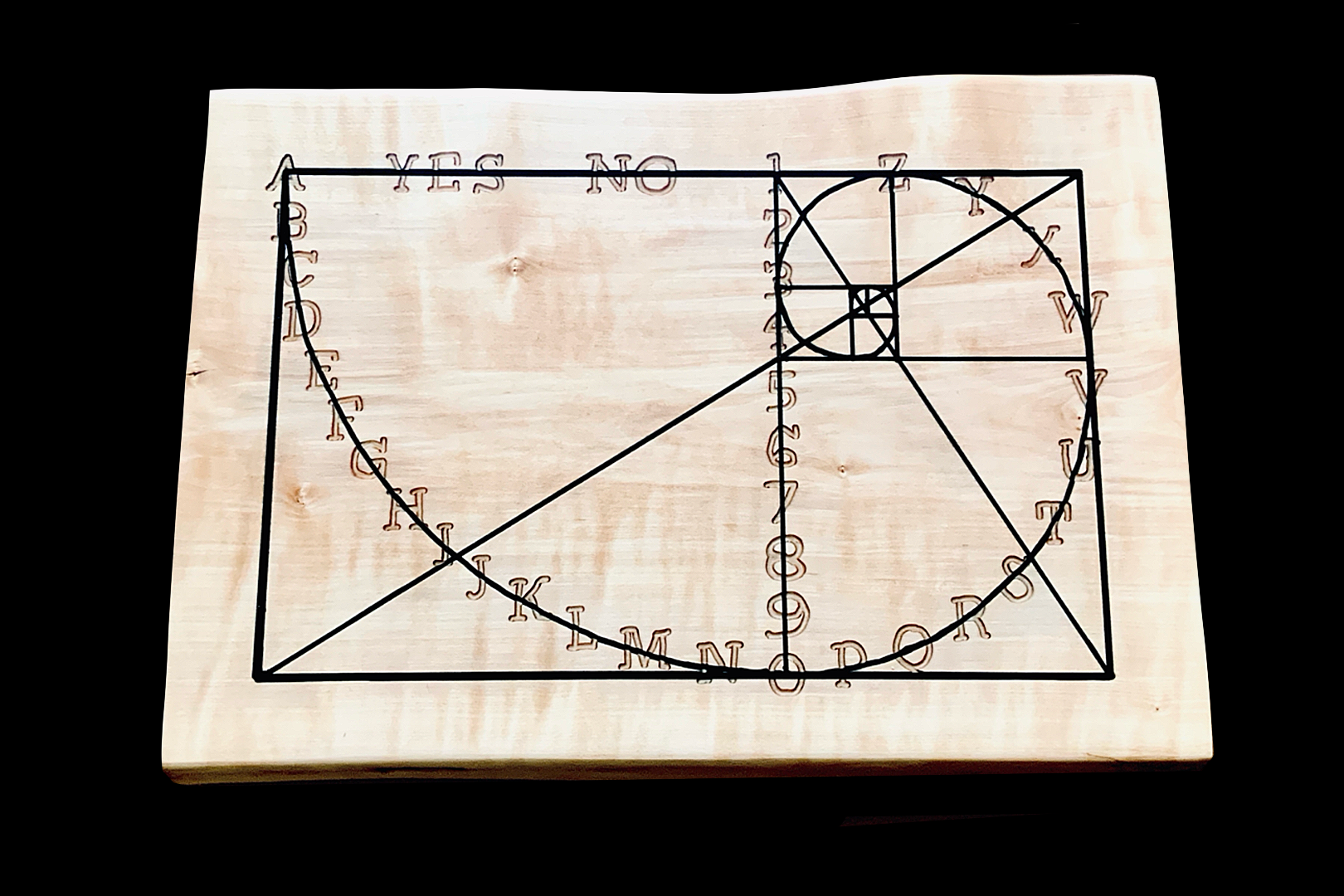 Handmade communication board with a design that resembles the golden spiral